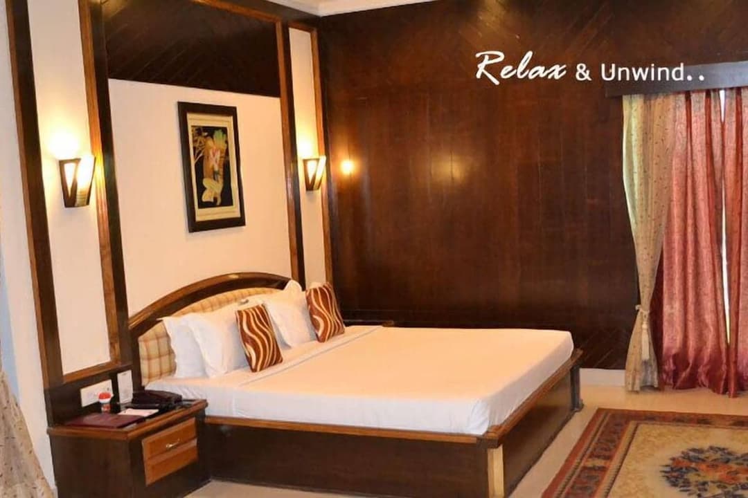 A guest room, with panelling behind the bed