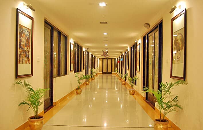 Interior corridor lined with plants