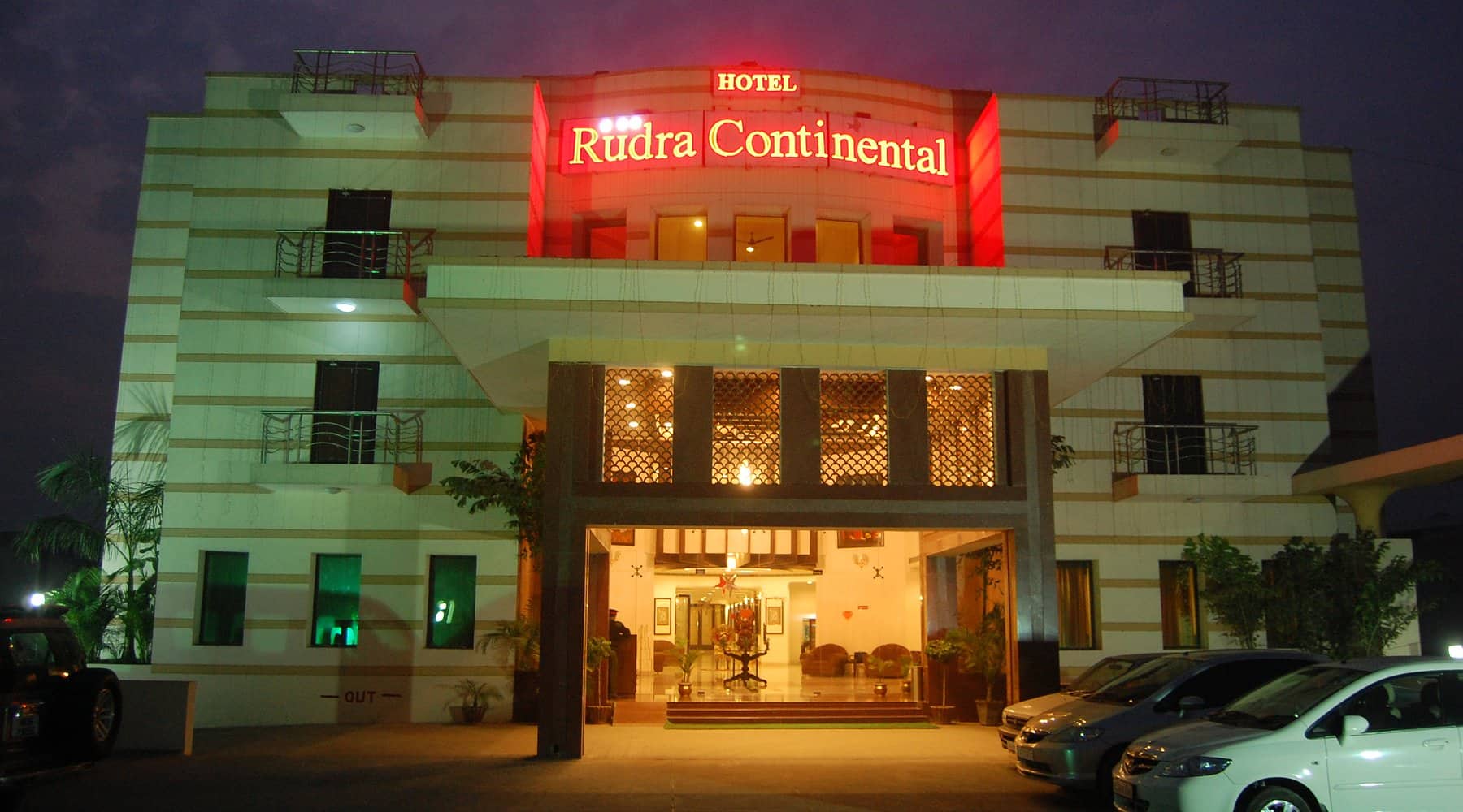 The hotel facade lit up at night
