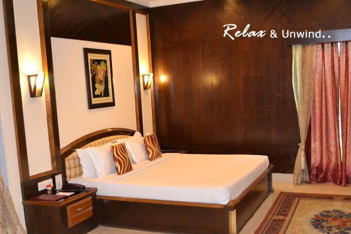 Room interior with wall panelling behind the bed