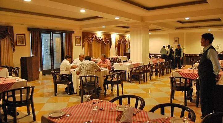 The restaurant's dining room with laid tables